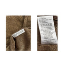 Close-up of Topshop label and care label on brown fabric