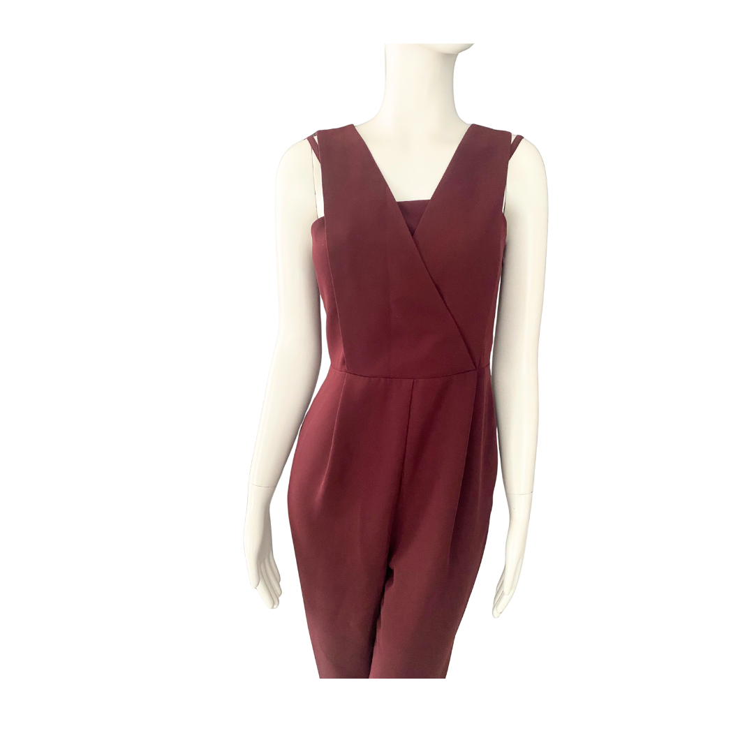 Maroon jumpsuit on a mannequin against a white background