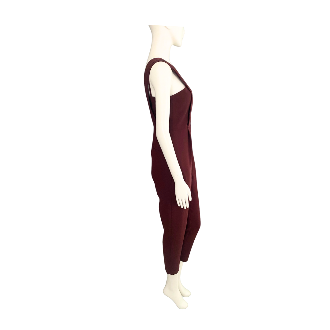 Mannequin wearing a burgundy sleeveless jumpsuit on a white background