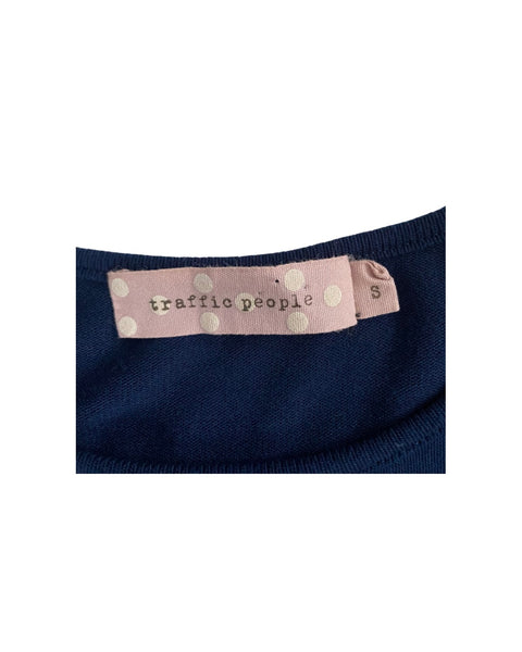 Navy blue fabric with a pink label featuring 'traffic people' text on a white background