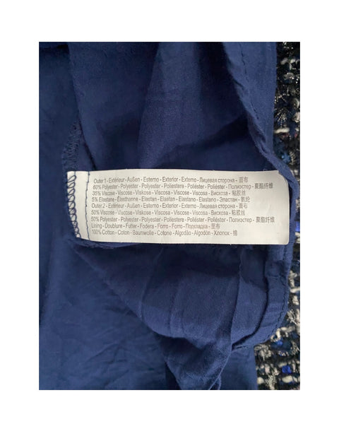 Close-up of a blue fabric with a label on a white background