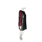 Mannequin wearing a sequined dress with a gradient of red to black on a white background