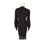 Black dress with lace detailing on a white background