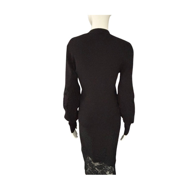 Black dress with lace detailing on a white background