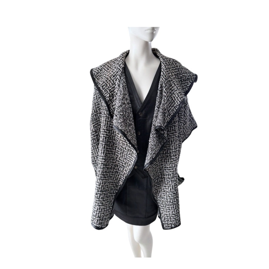 Black and white patterned jacket on a mannequin against a white background