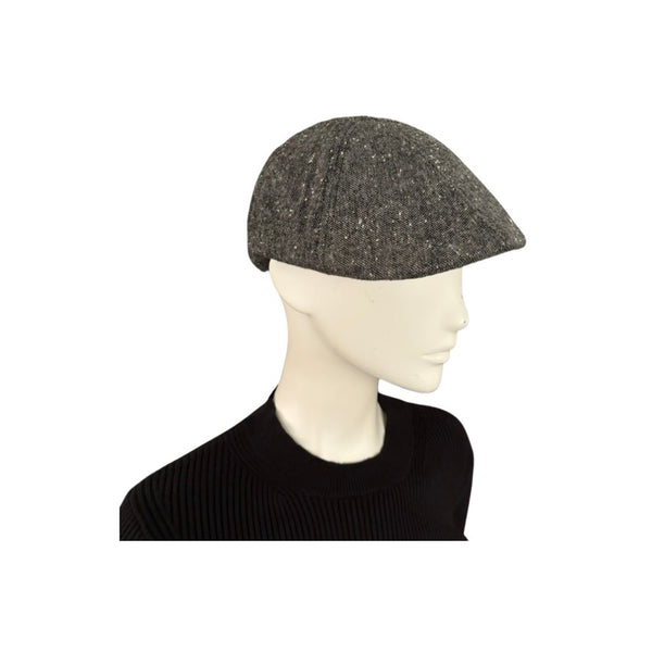 Mannequin head wearing a dark gray knit cap on a white background