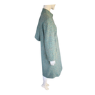 Green textured coat on a mannequin against a white background