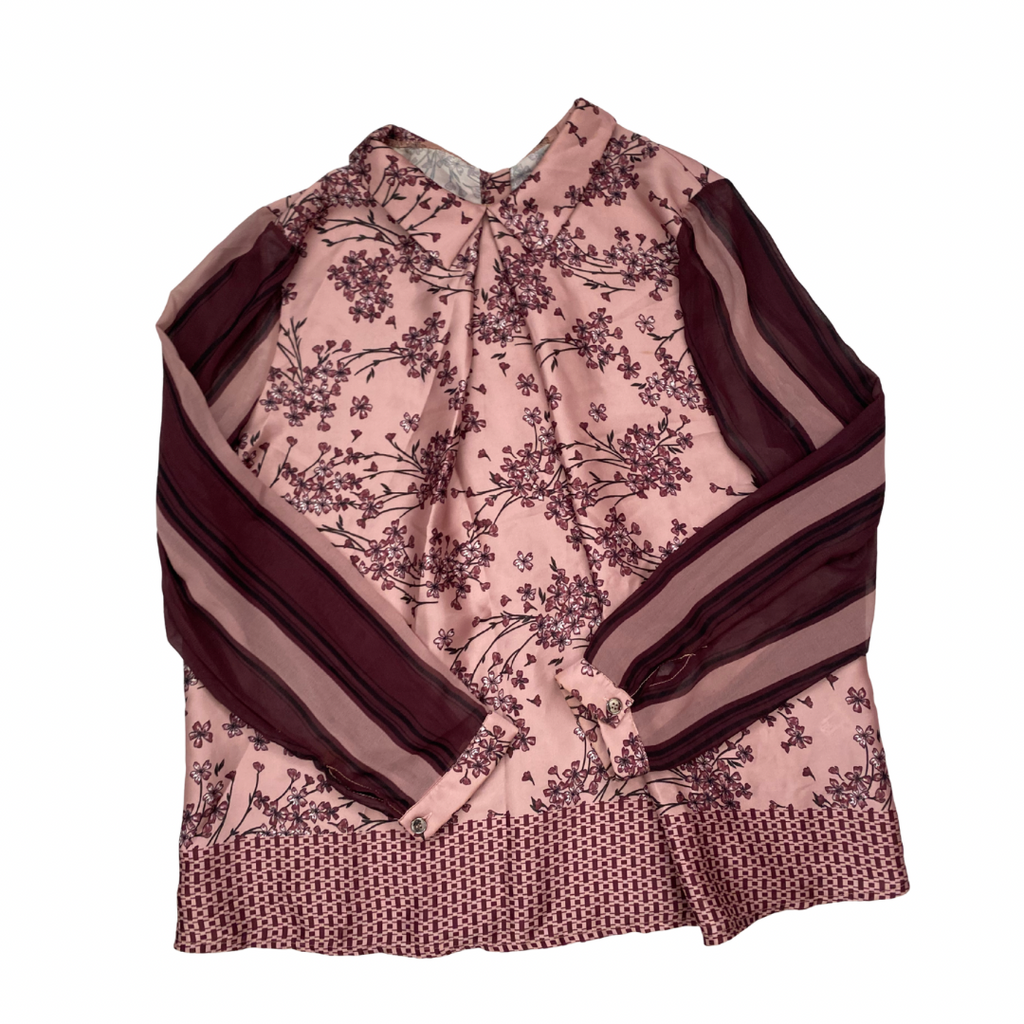 Pink floral blouse with brown stripes on a white background