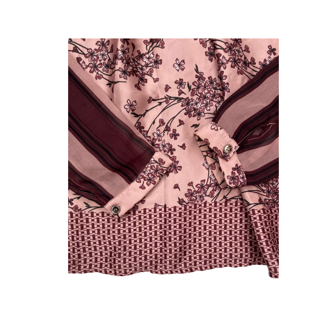 Pink shirt cuffs with floral and geometric patterns on a white background