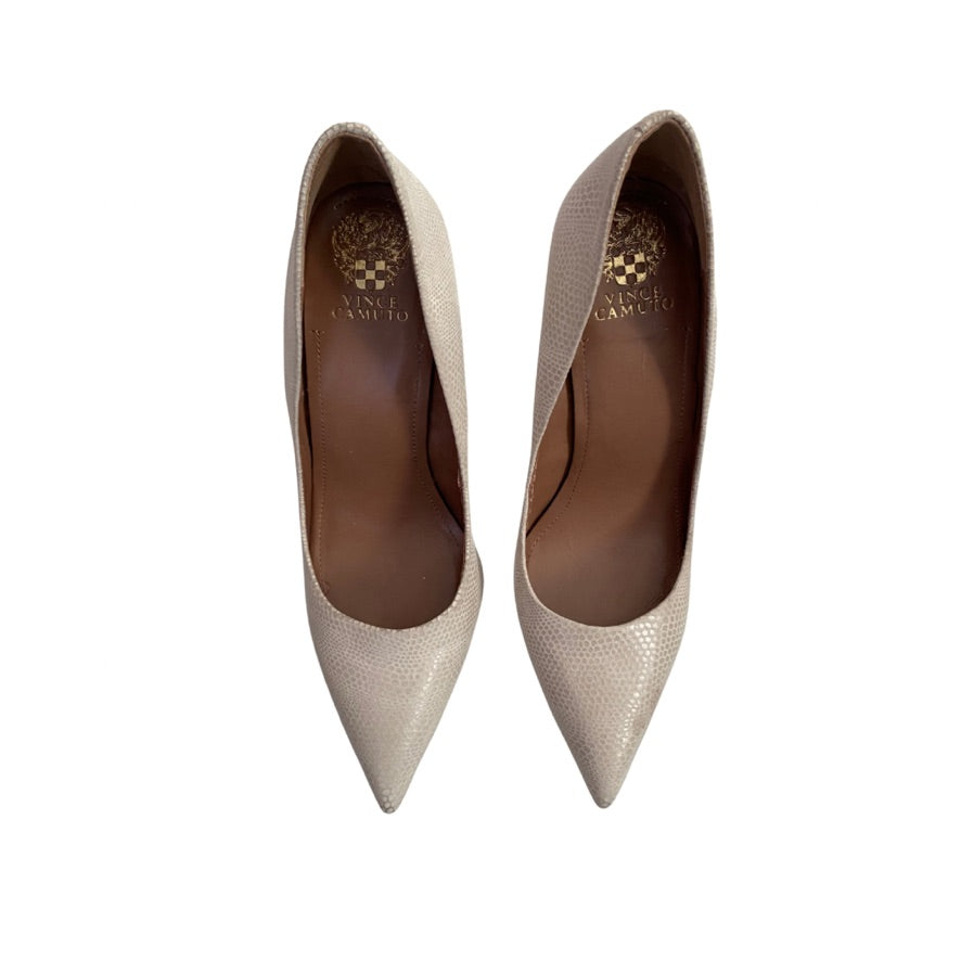 Pair of beige high-heeled shoes on a white background
