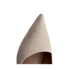 Textured stiletto shoe point on a white background