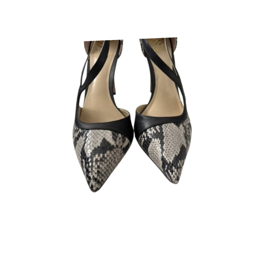 Pair of pointed-toe high heels with snake print and black accents on a white background