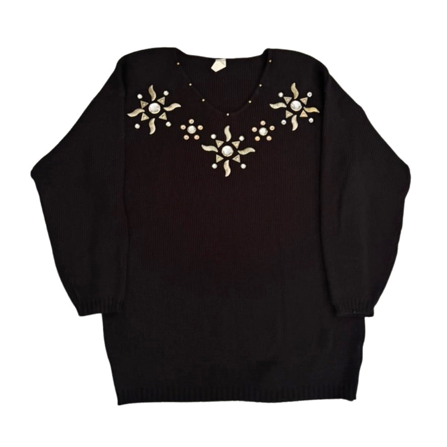 Black sweater with gold embellishments on a white background