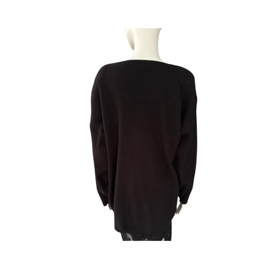 Black sweater on a mannequin against a white background