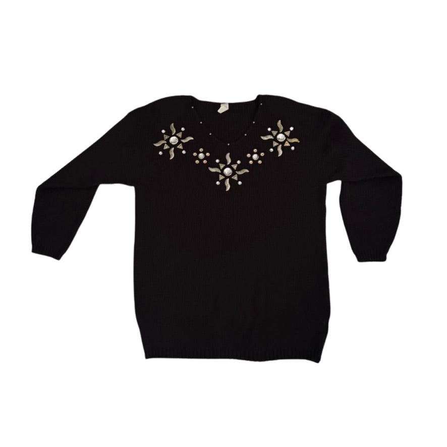 Black sweater with decorative elements on a white background