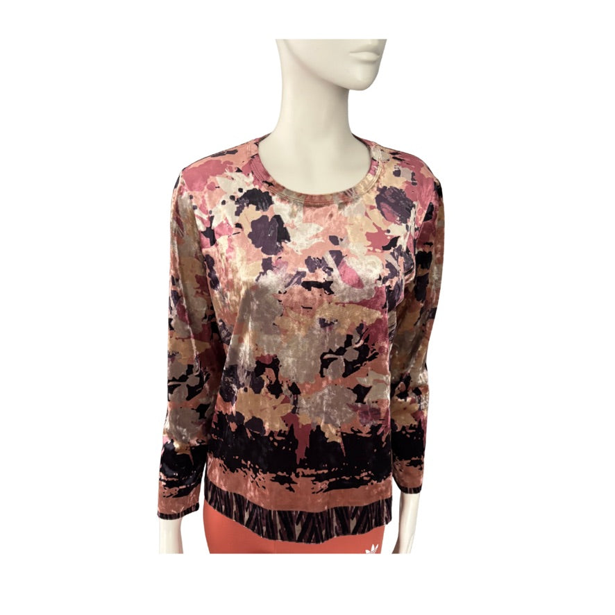 Mannequin wearing a floral-patterned sweater on a white background