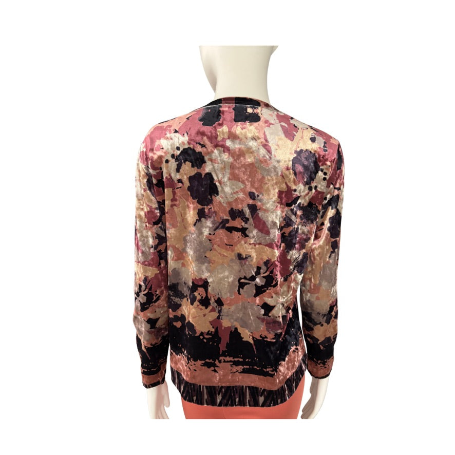 Multicolored patterned sweater on a mannequin against a white background