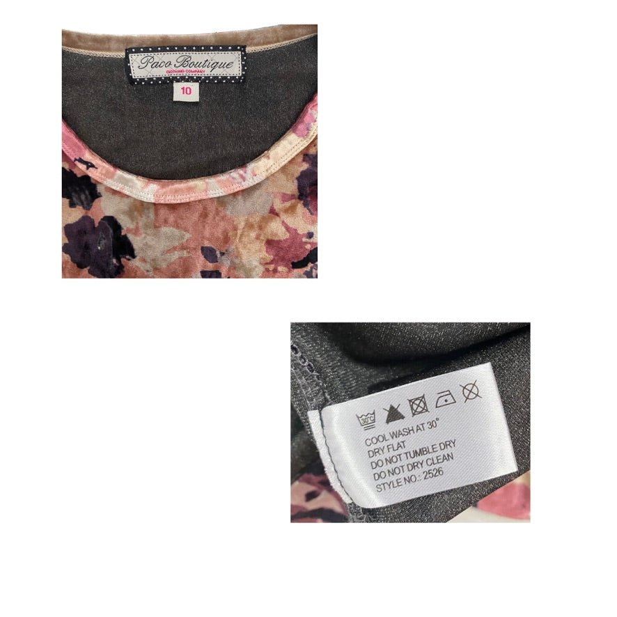 Close-up of a floral garment with a label and care instructions.