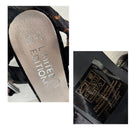 Close-up of a shoe sole with 'Limited Edition' text and a label on a white background.