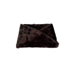 Dark brown fur headband on a white background