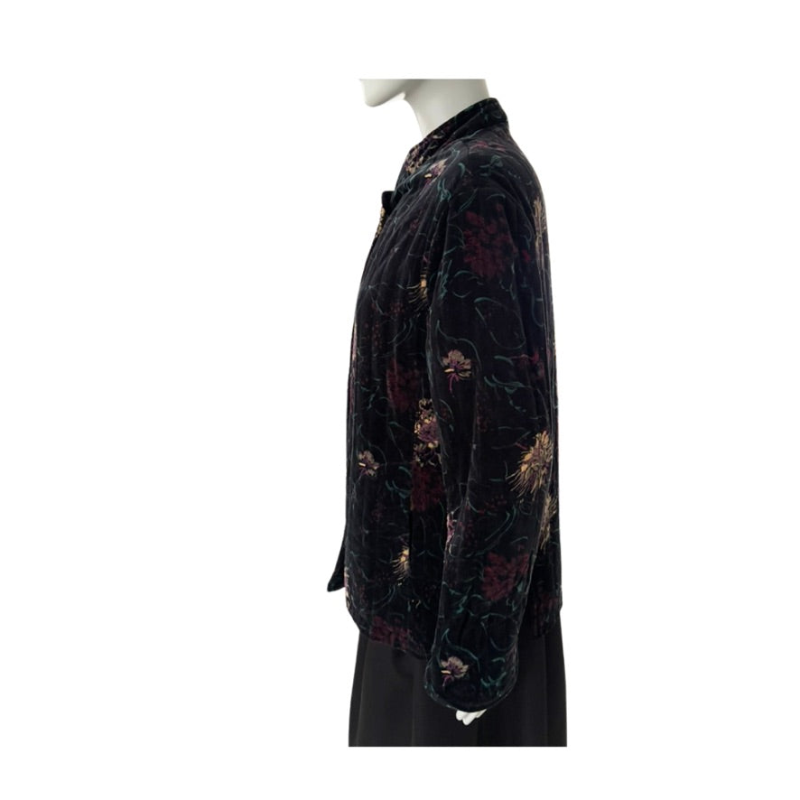 Mannequin wearing a black floral patterned jacket on a white background