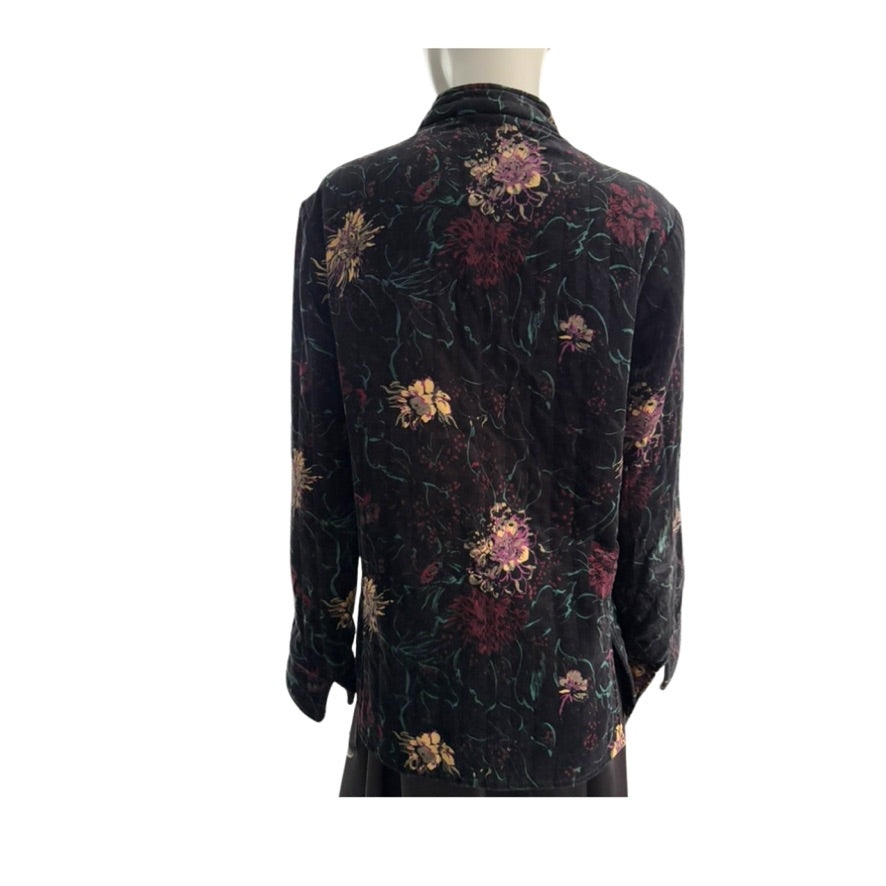 Black floral patterned dress on a mannequin against a white background