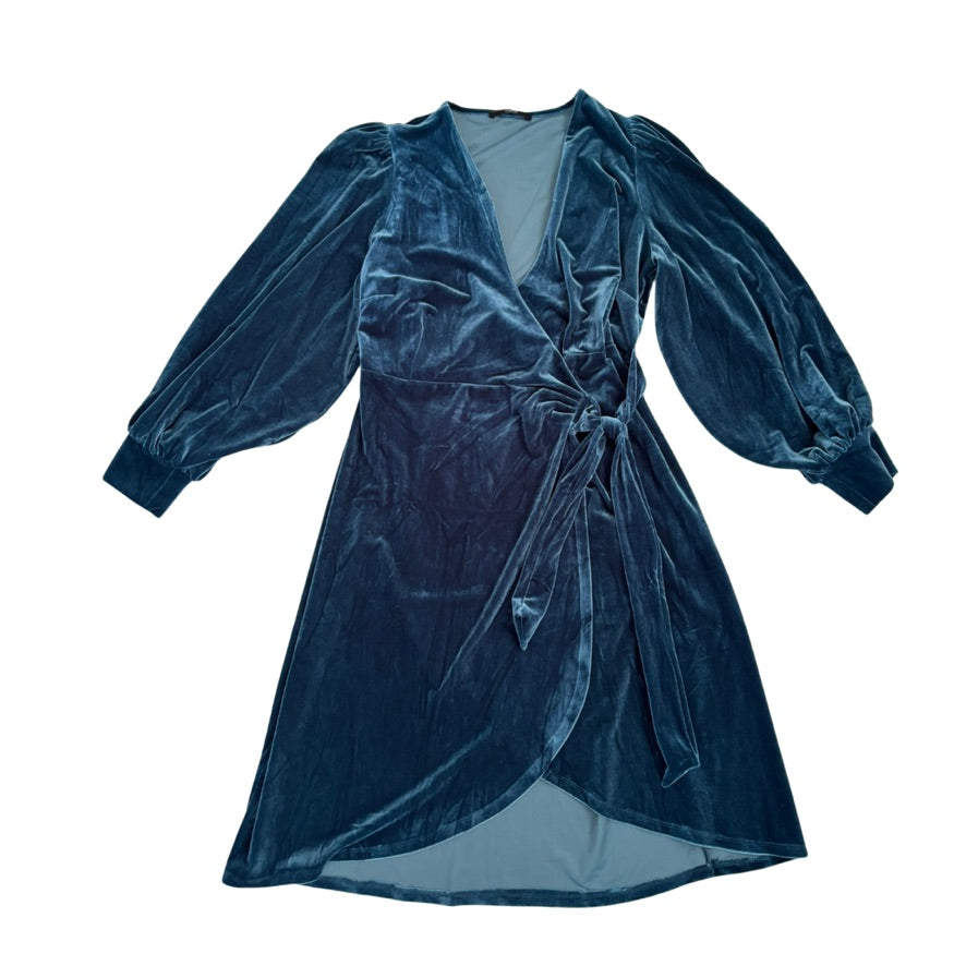 Blue velvet dress with long sleeves on a white background