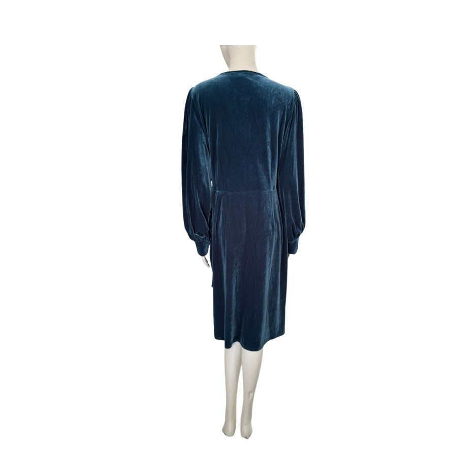 Teal blue velvet dress on a mannequin against a white background