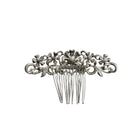 Decorative silver hair comb on a white background