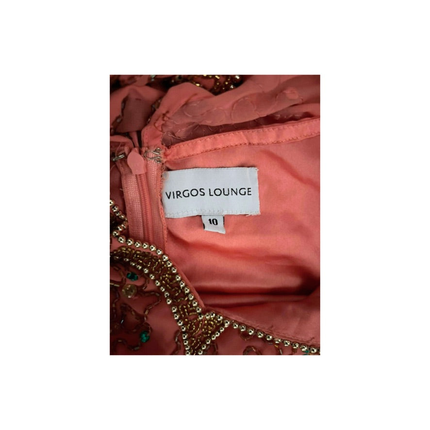 Close-up of a pink garment with 'Virgos Lounge' label on a white background