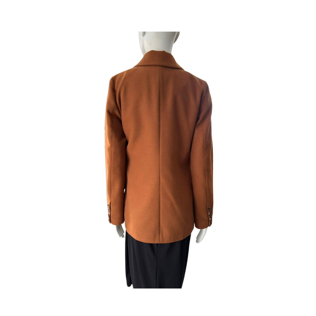 Brown coat on a mannequin against a white background