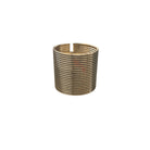 A gold cuff bracelet with a corrugated design and hinge fastening.