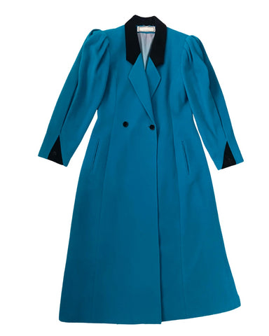 Blue coat with black collar and buttons on a white background