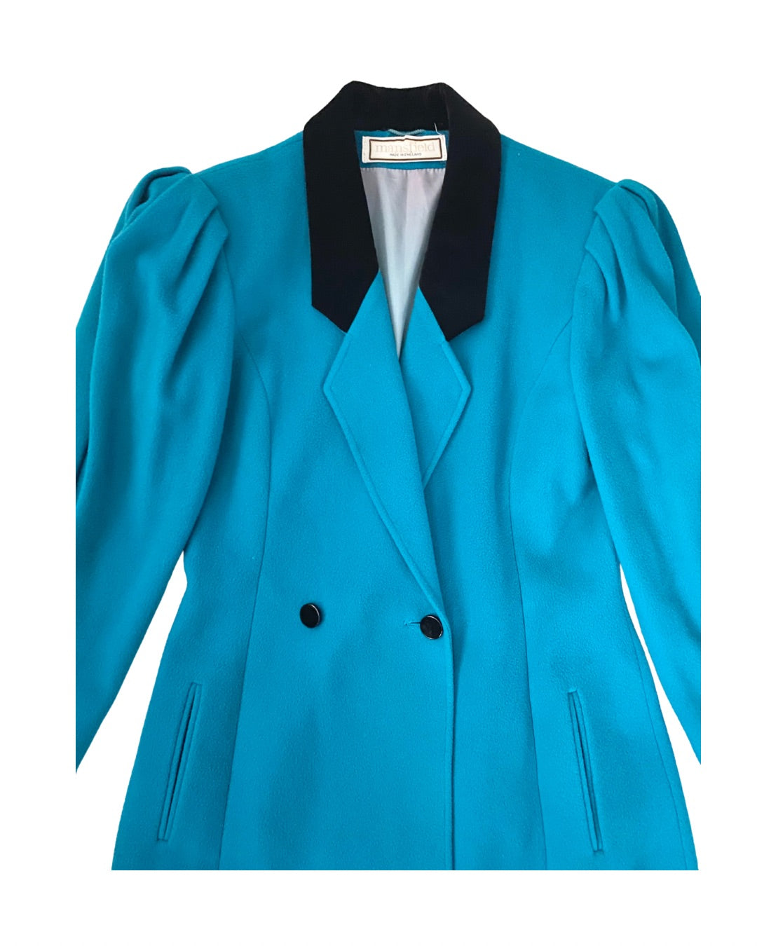 Blue blazer with black collar and buttons on a white background