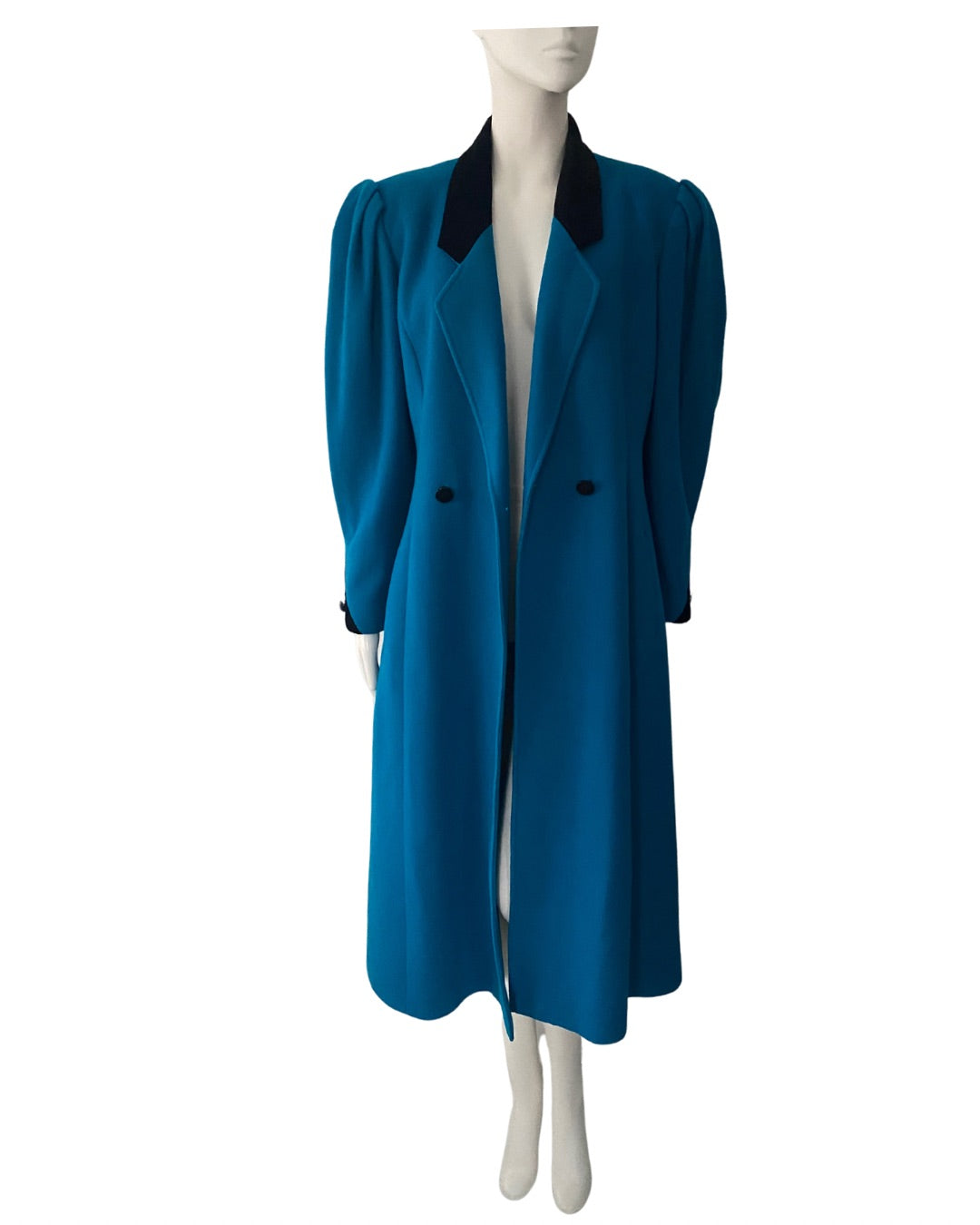 Blue coat on a mannequin against a white background