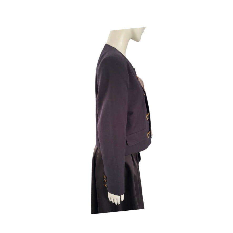 navy jacket with gold buttons on a mannequin against a white background