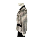 Houndstooth patterned blazer on a mannequin against a white background