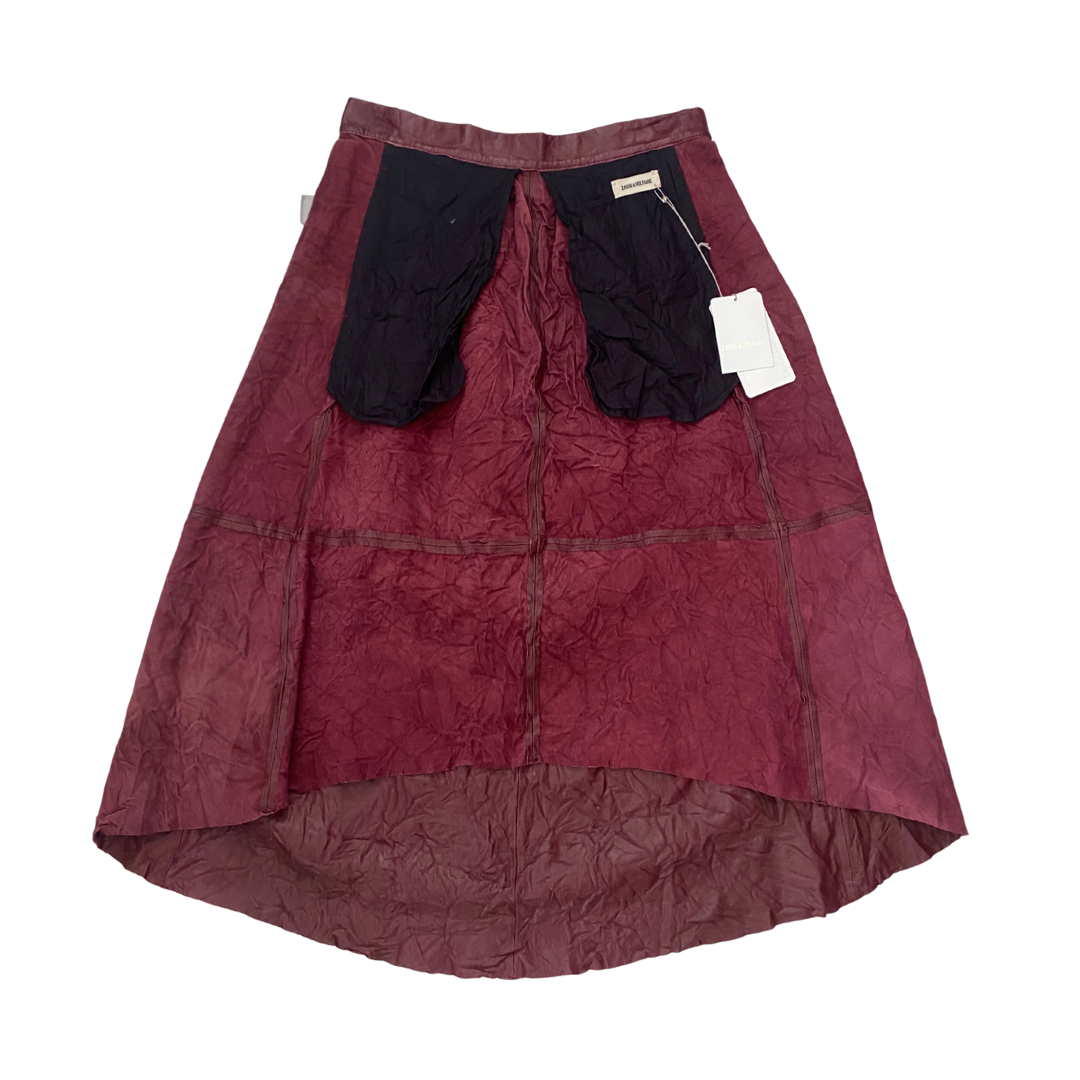 Maroon skirt inside out on a white background