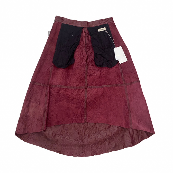Maroon skirt inside out on a white background