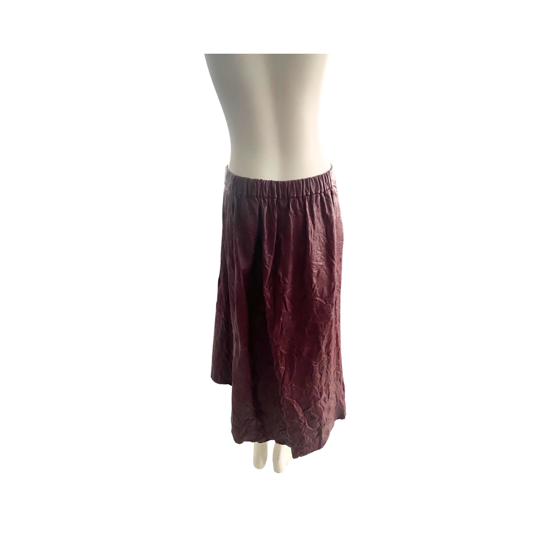 Maroon skirt on a mannequin against a white background
