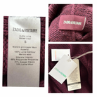 Collage of Zadig & Voltaire labels on a burgundy fabric on white background