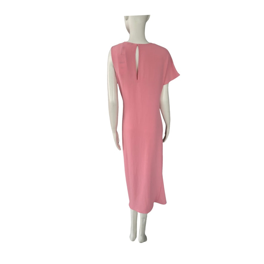 Mannequin wearing a pink dress on a white background