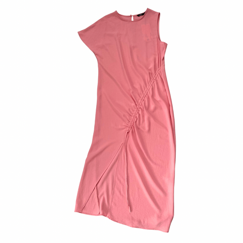 Pink dress with a side slit on a white background