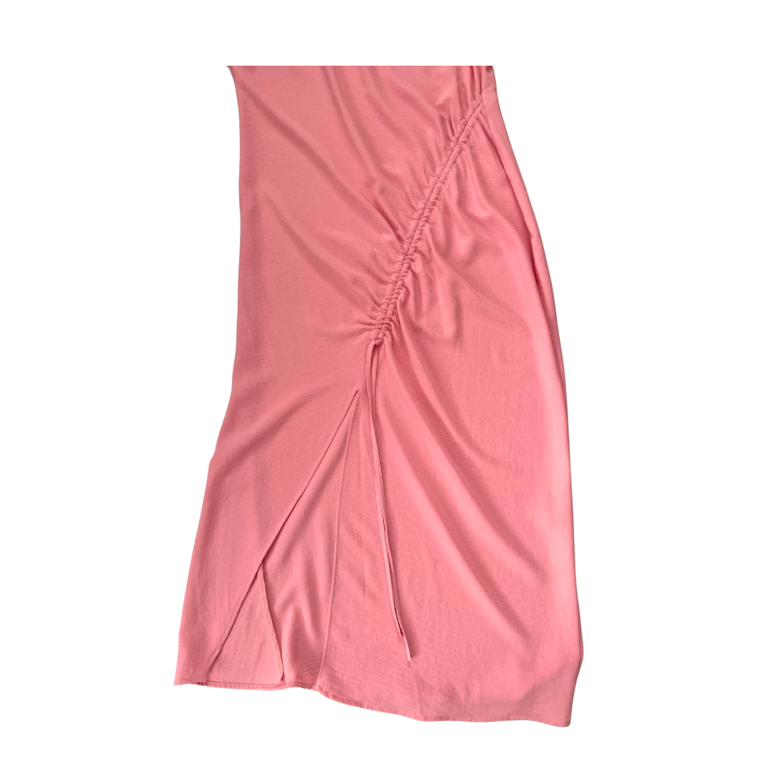 Pink dress with a ruched side panel on a white background