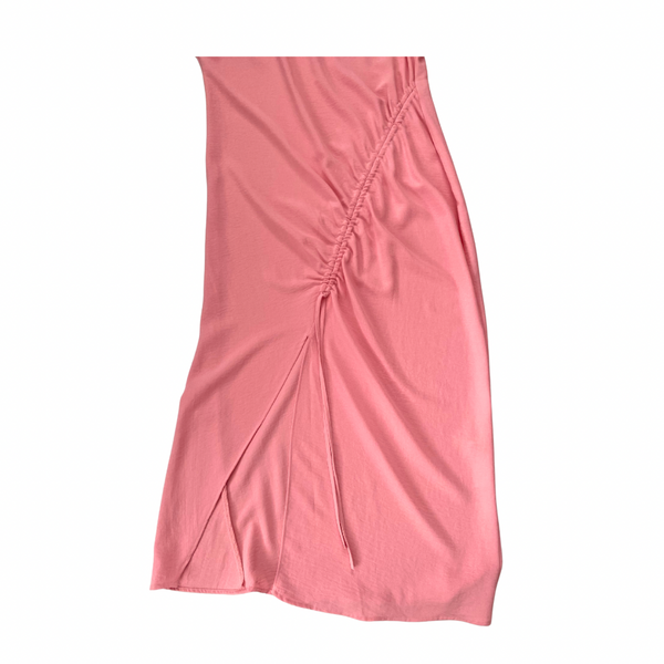 Pink dress with a ruched side panel on a white background