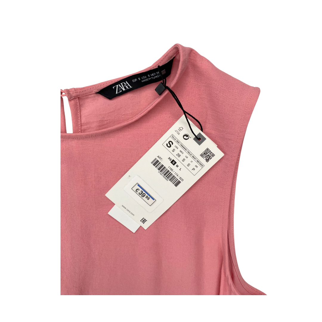 Pink sleeveless top with a Zara tag on a white background