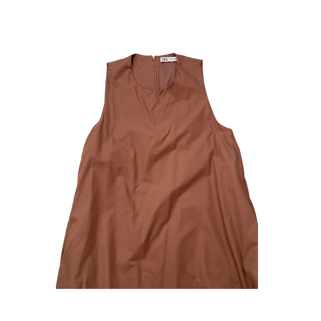Brown sleeveless dress on a white background