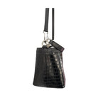 Black crocodile-patterned handbag with a strap on a white background
