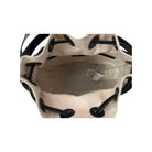 Beige drawstring bag with black drawstrings on a white background