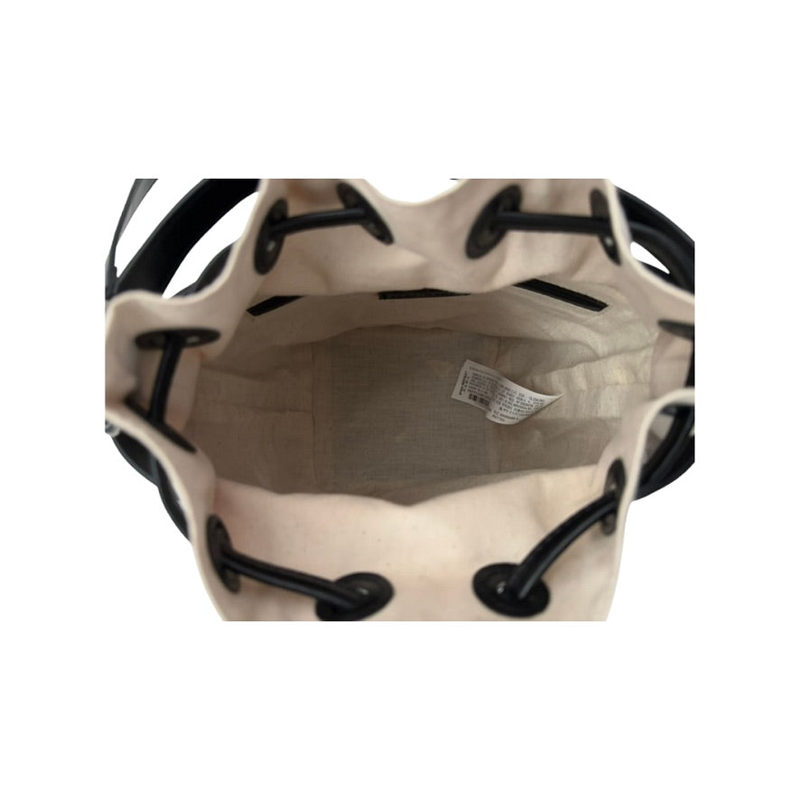 Beige drawstring bag with black drawstrings on a white background